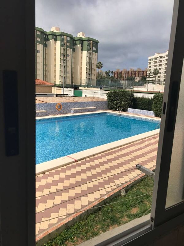 Vista a la piscina Apartamento Grau y Playa