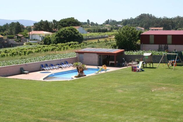 Casa para 8 pers. con piscina compartida, jacuzzi y jardín en Sanjenjo